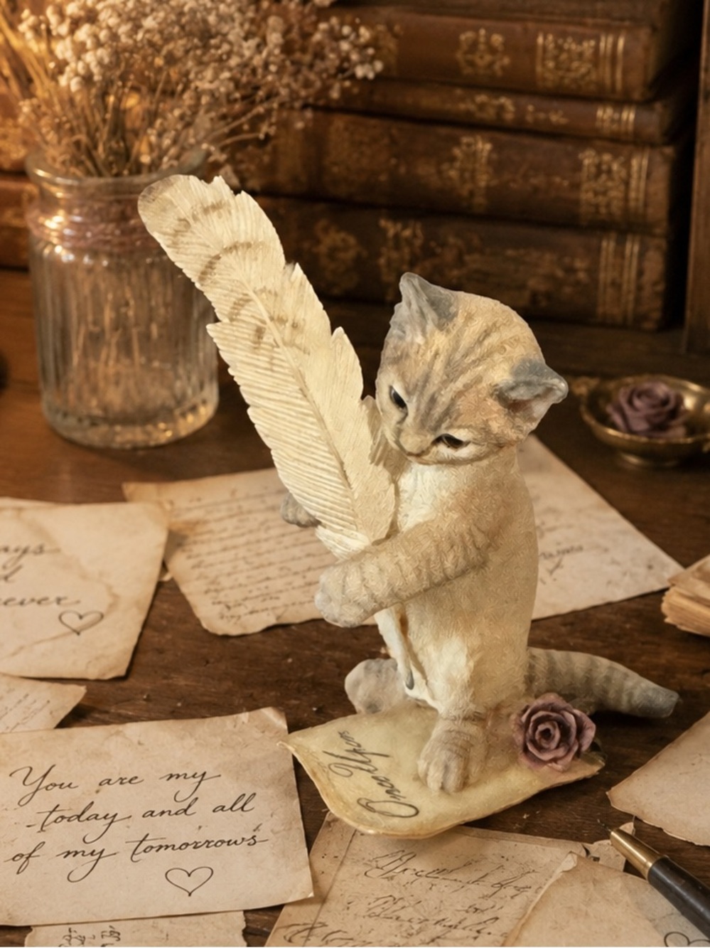 Country Artists Love Story" figurine, a realistic kitten with a  feather